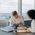 Buffalo New York employment lawyer credit check ban office workers reviewing documents