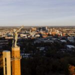 civilrightsattorneybirminghamal ReachAttorneys Vulcan statue overlooking the Birmingham Alabama skyline at sunset