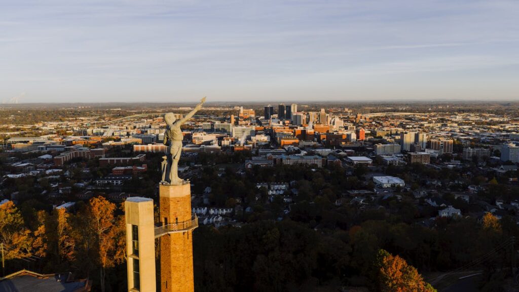 civilrightsattorneybirminghamal ReachAttorneys Vulcan statue overlooking the Birmingham Alabama skyline at sunset