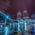 pexelsphoto37411048 ReachAttorneys Cincinnati skyline at night over wet streets where Ohio OVI enforcement happens